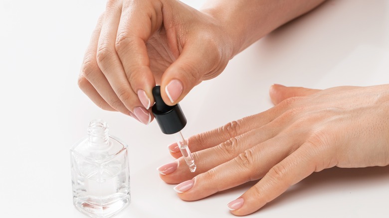 person applying nail lacquer