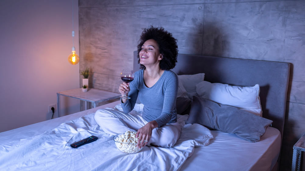 woman eating in bed