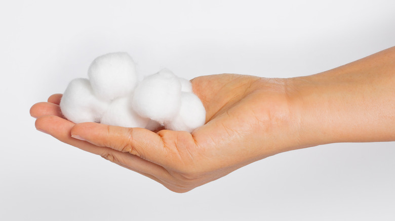 hand with cotton balls