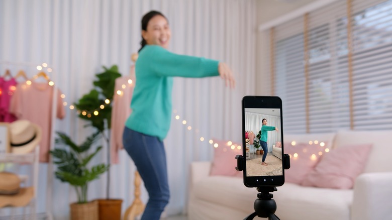 Woman filming herself on phone