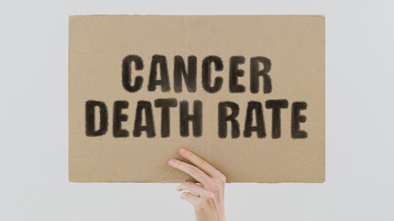 sign reads 'cancer death rate'