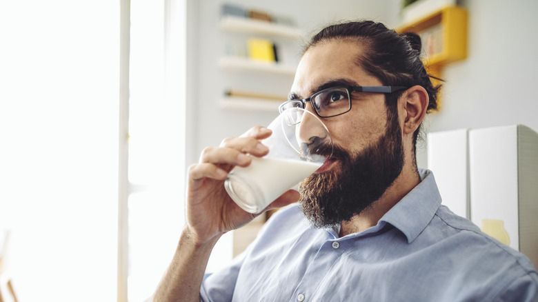 Man drinking a glass of milk