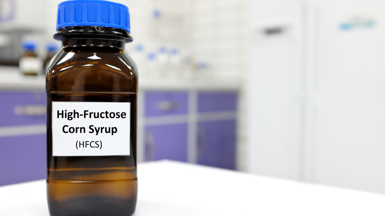 A lab bottle marked as high fructose corn syrup