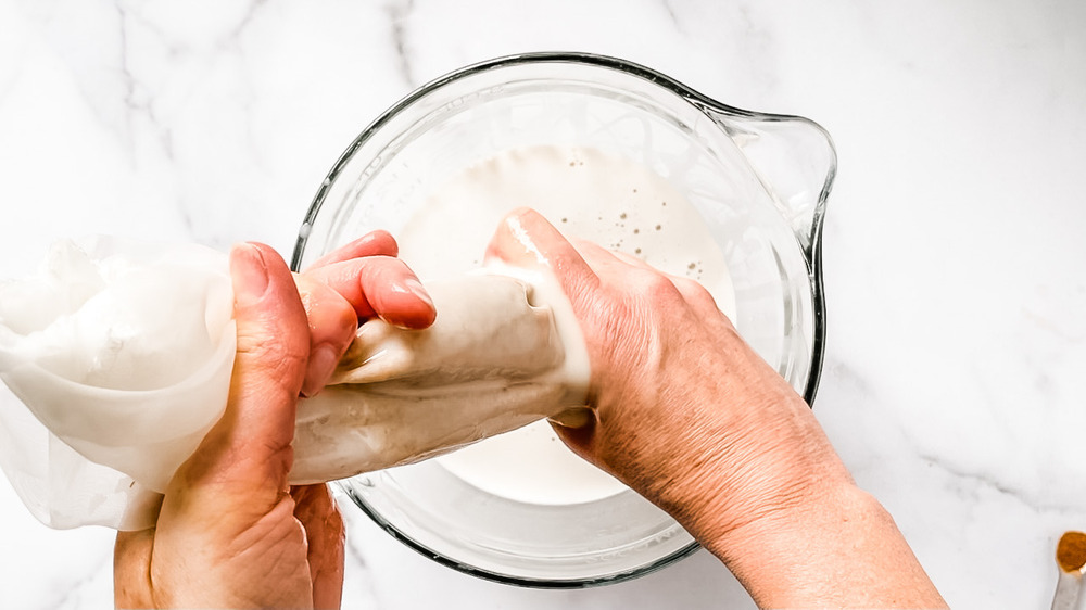 straining oat milk