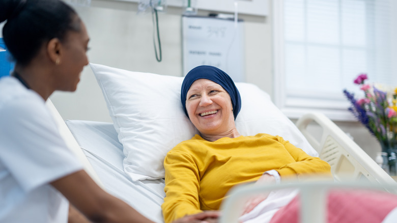 cancer patient smiling while receiving treatment