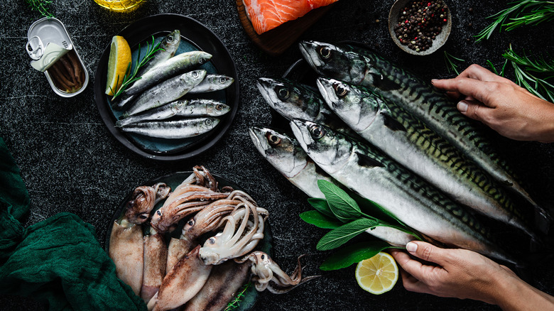 Sardines and other seafood varieties on a table