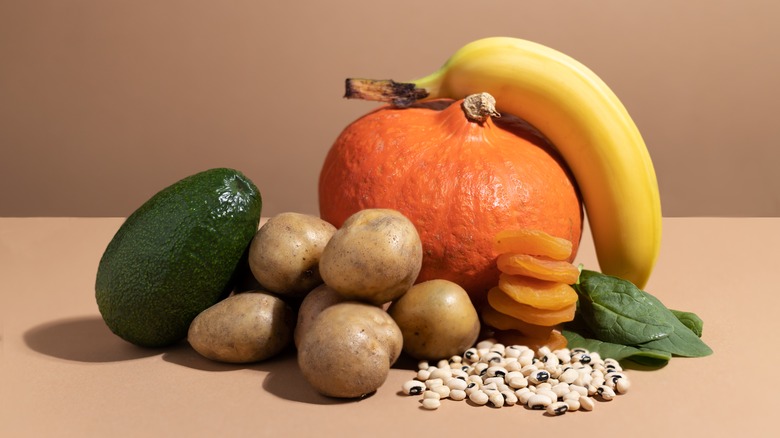 table with banana, pumpkin, avocado, potatoes