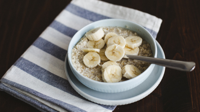 bowl of oatmeal topped with bananas