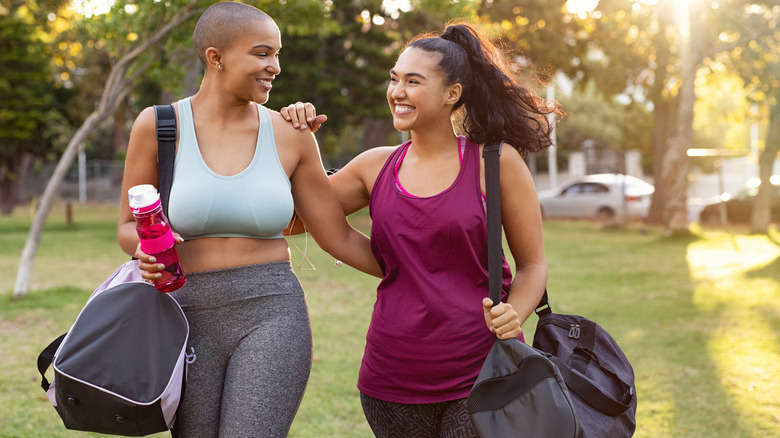 Two friends walking in workout gear