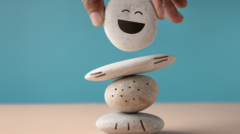 balancing stones with a smiley face
