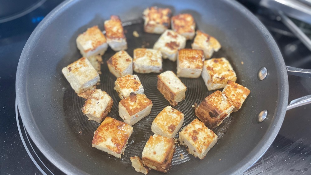 tofu cubes in a skillet