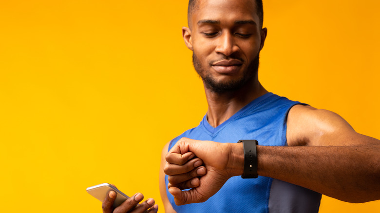 man looking at watch