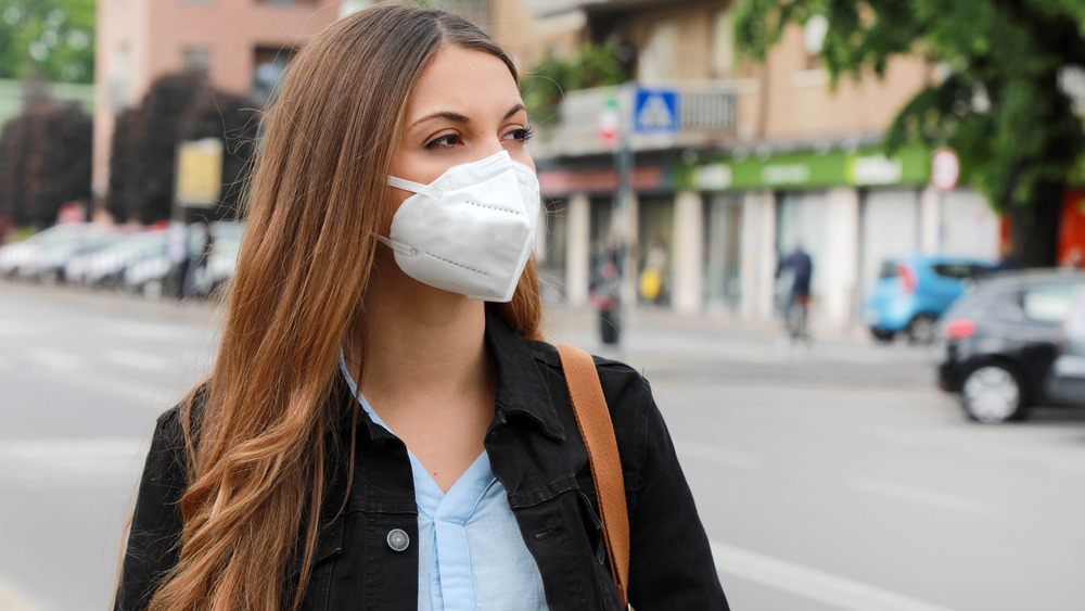 Woman walking wearing KN95 mask