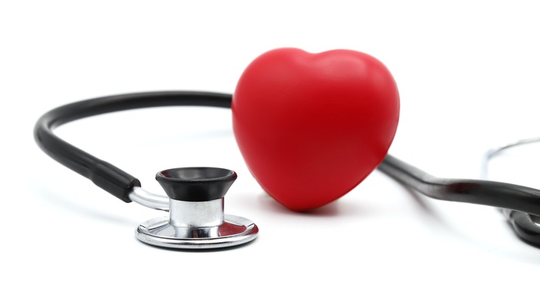 Model heart pictured with stethoscope
