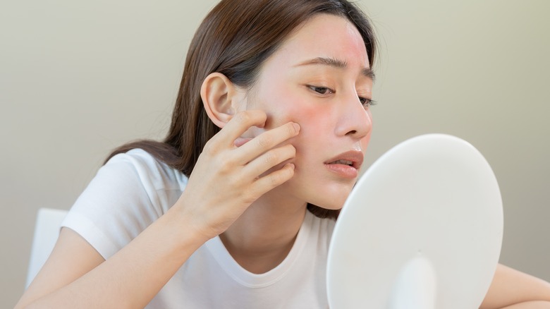 woman cleaning skin rash