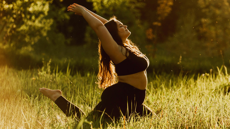 woman doing yoga in sunlight