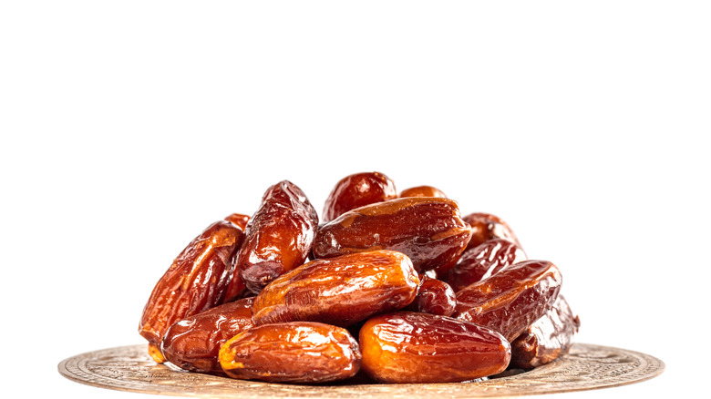 Dates stacked on a plate