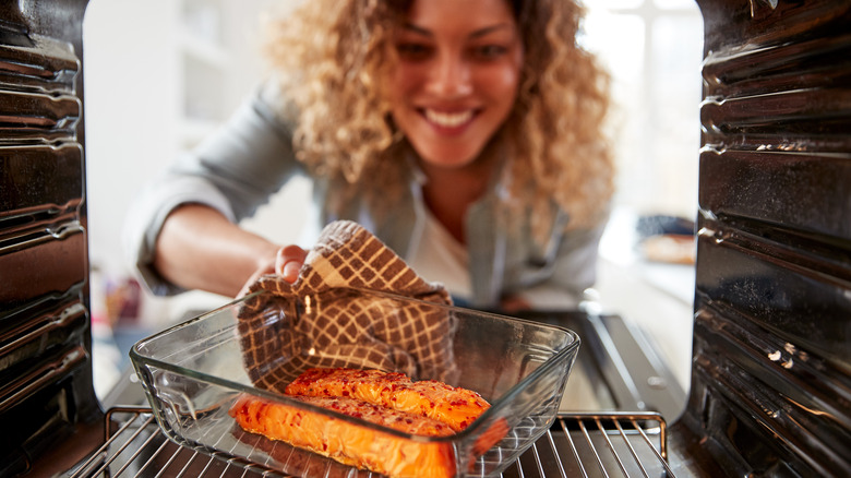 a woman cooking catfish 