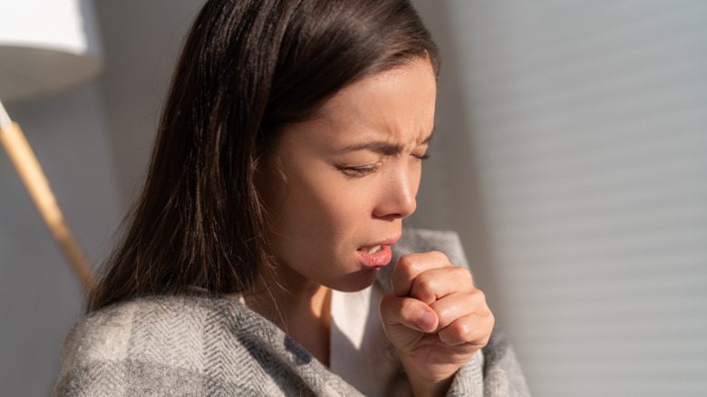 Woman coughing