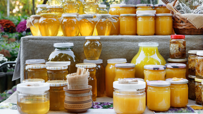 different types of honey on a shelf