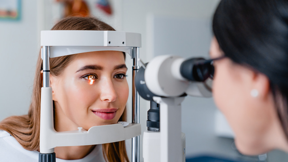 Eye doctor examining a patient's eye
