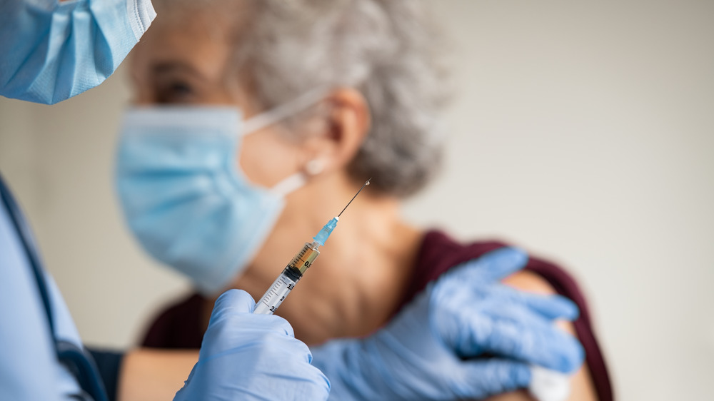 Older patient getting a vaccine