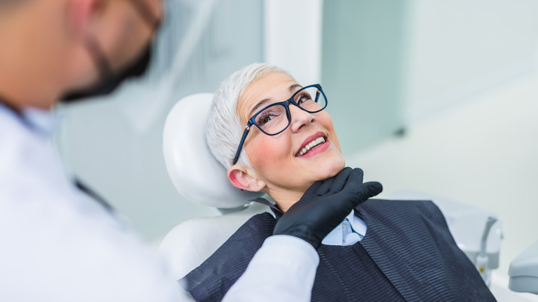 A woman is at the dentist