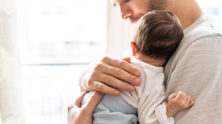 Man holding an infant