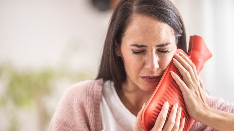 Woman soothing tooth pain