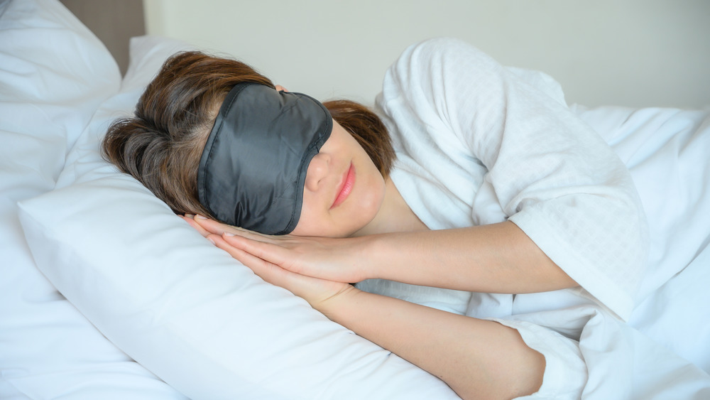 woman wearing sleep mask