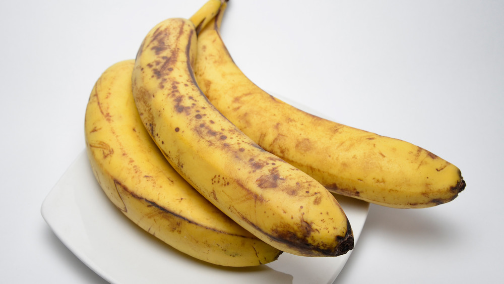 aging bananas on a plate