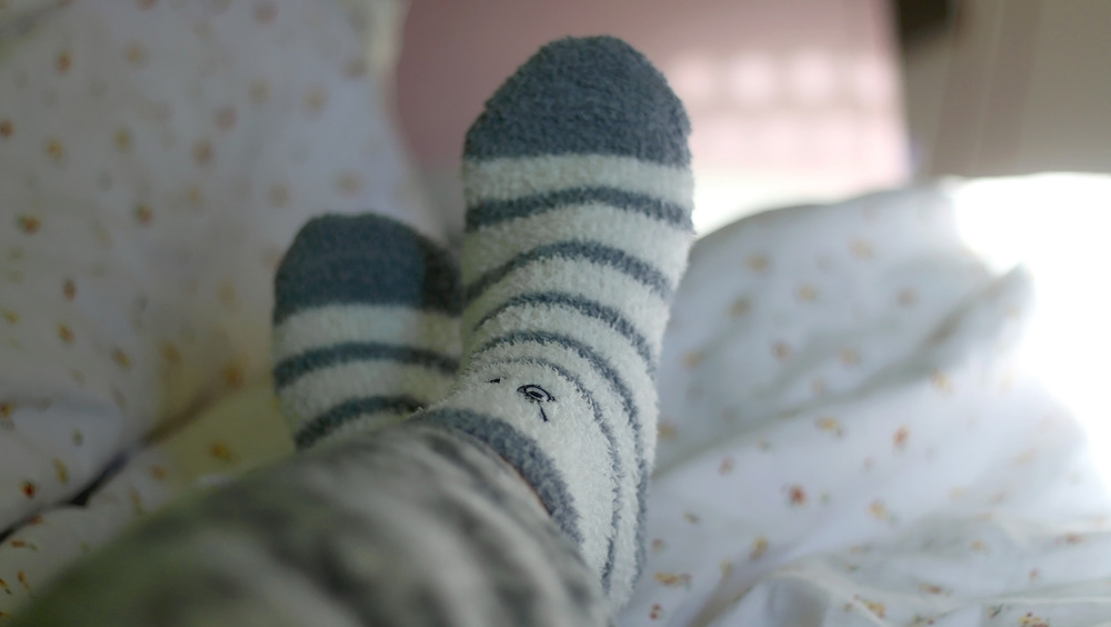 Two feet in fuzzy socks