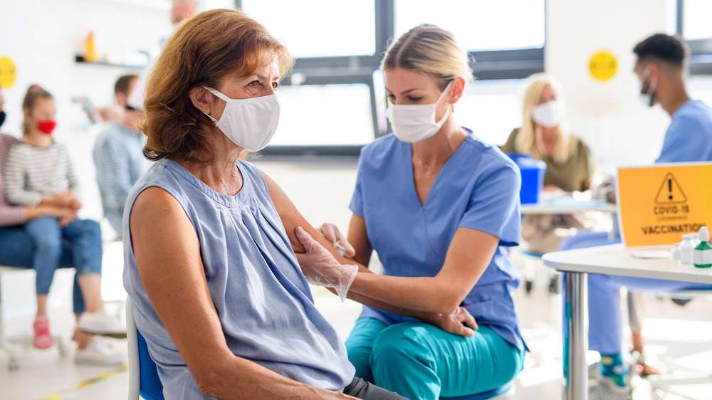 woman getting the COVID-19 vaccine