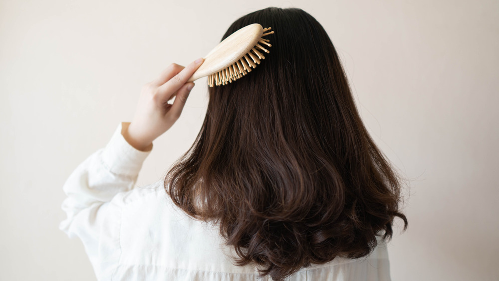 Woman brushing her hair