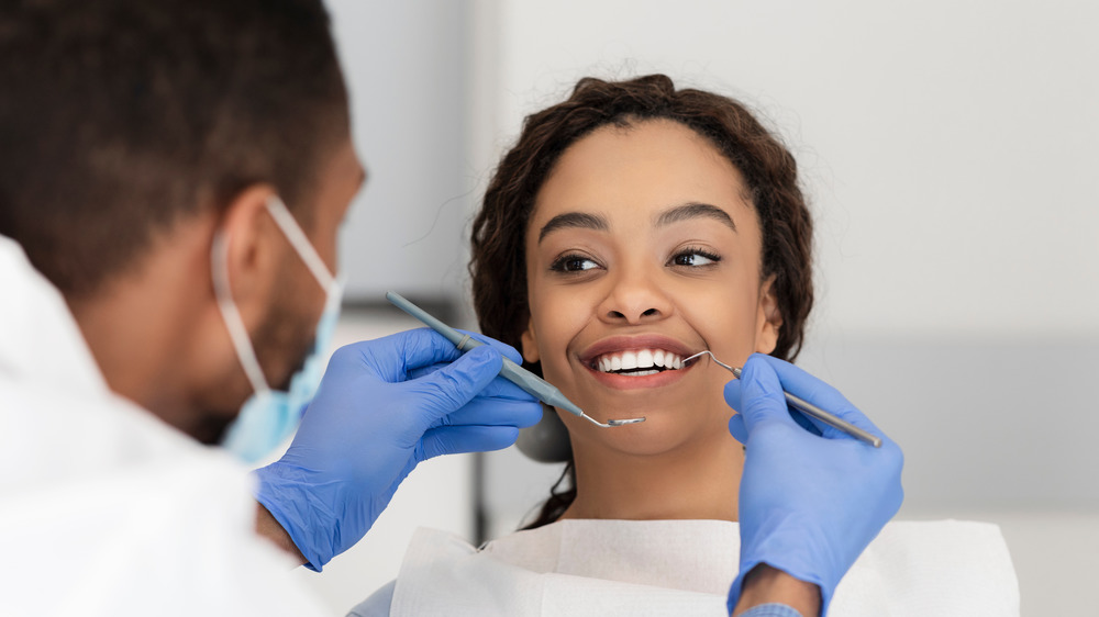 Woman getting dental checkup