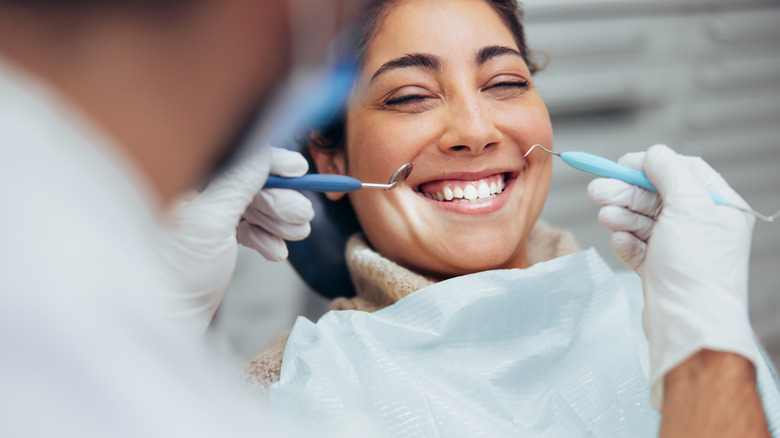 Woman smiling in a dentist's chair