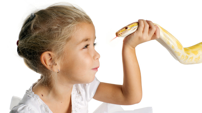 girl holding python