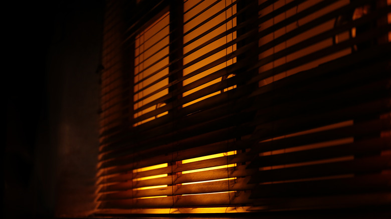 light through blinds in dark room
