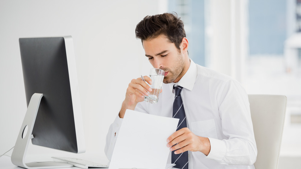 Businessman drinking glass of water