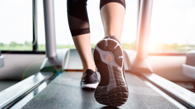 Legs walking on treadmill