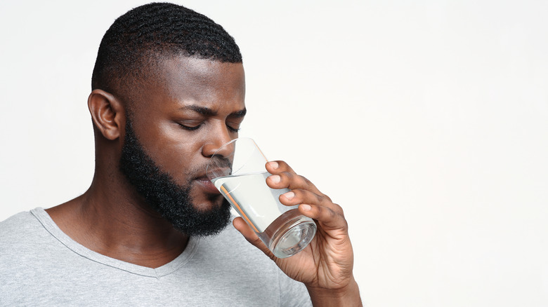 Man drinking glass of water