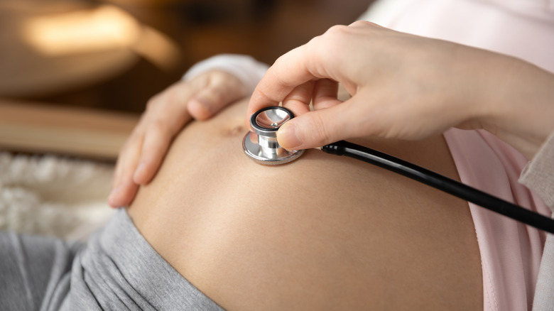 stethoscope on pregnant belly