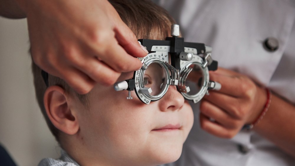 Boy taking eye exam