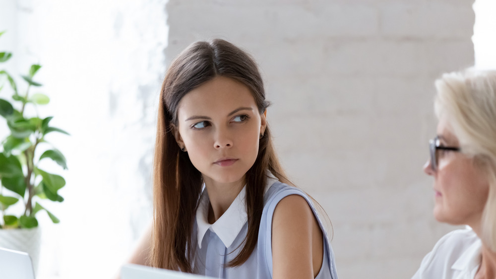 Unhappy woman with coworker