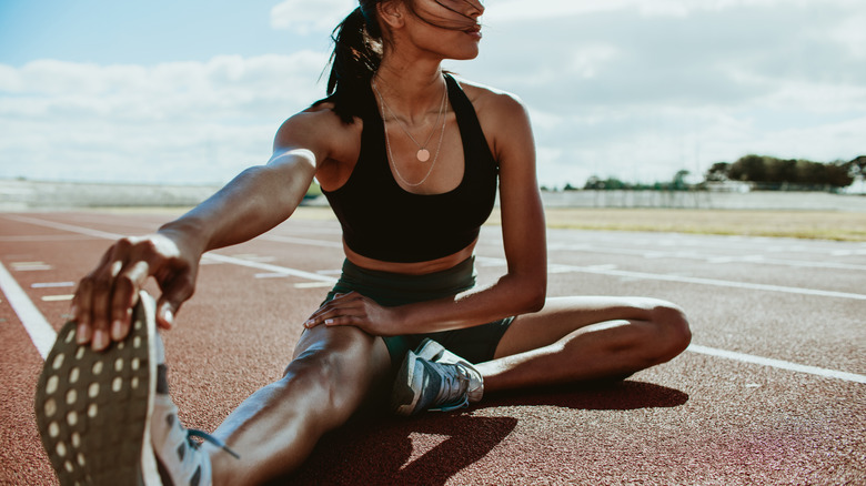 Athletic woman stretching