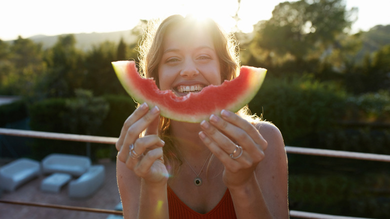 Woman holding watermelon fruit