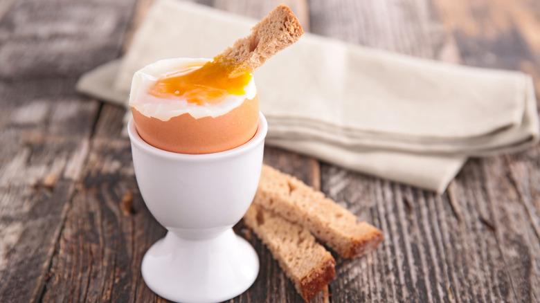 soft-boiled egg with toast dipped