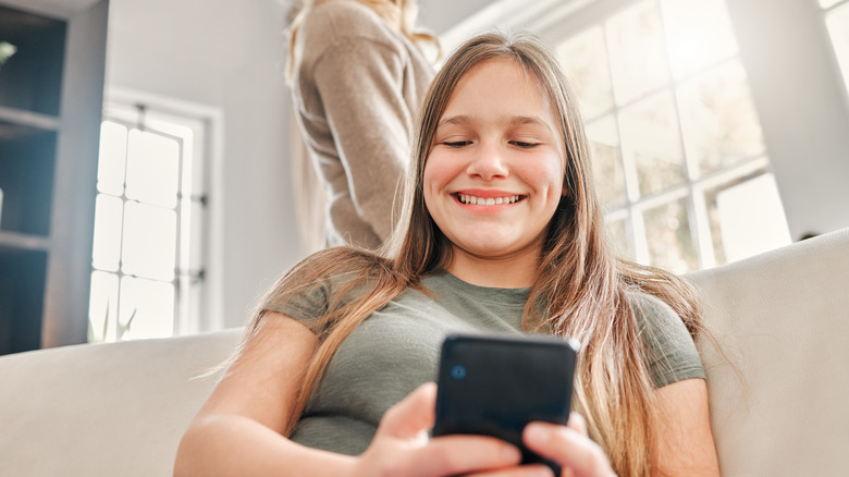 young woman looking at phone 