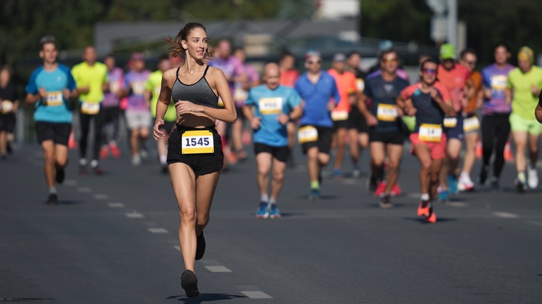 A female runner during a race with other runners