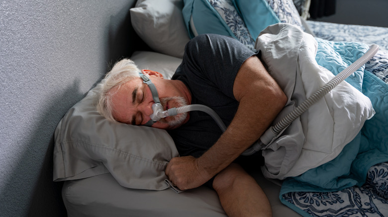 Individual wearing a sleep apnea machine